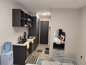a bathroom with a sink and a mirror at Nene Homes in Marimbeti