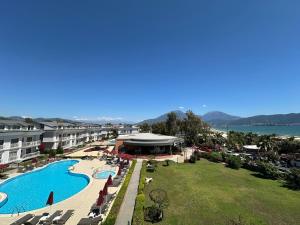 an aerial view of a resort with a swimming pool at Defne Beach Karya in Fethiye