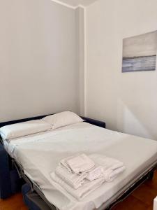 a bed with towels on it in a room at Casa Tropea Vibes in Tropea +15 photos