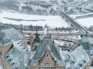 an aerial view of a building with snow on the roof at Fairmont Hotel Macdonald in Edmonton
