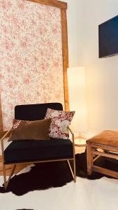 a living room with a couch and a table at La Grange de Magdeleine in Salles-la-Source