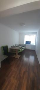a room with a bed and a desk and a window at Ela Gar 2 WG Zimmer in Garsten