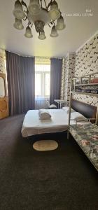 a bedroom with a large bed and two bunk beds at Corps Rose Velley in Almaty +122 photos