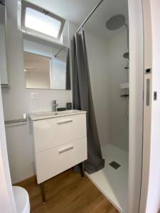 a bathroom with a sink and a mirror at Hulot-838-Iodine parenthesis in Frontignan