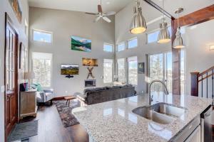 a kitchen with a sink and a living room at Mountain Escape with Spectacular Views in Jefferson