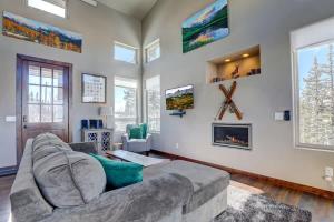 a living room with a couch and a fireplace at Mountain Escape with Spectacular Views in Jefferson +22 photos