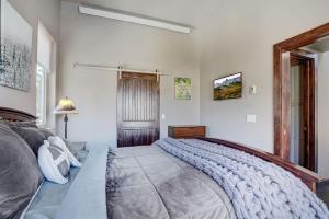 a bedroom with a large bed and a window at Mountain Escape with Spectacular Views in Jefferson