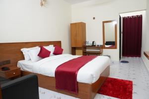 a bedroom with a large bed and a mirror at Hotel Comfort Inn Sylhet in Sylhet +29 photos