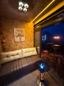 a living room with a couch and a table at Minnie Diamond in Divčibare