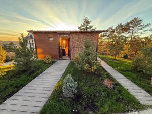 a small house on a hill with a pathway at Minnie Diamond in Divčibare
