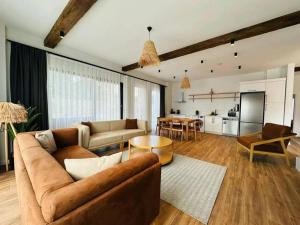 a living room with a couch and a table at Quba in Quba