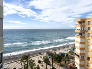 a view of the beach from a building at Increíbles vistas al mar A102 in Torrox Costa