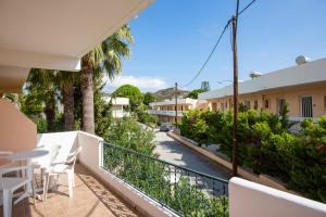 a balcony with a view of a street at Diagoras Hotel All Inclusive in Faliraki
