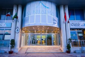 a building with the entrance to a cafe at Al Khaima City Center in Nouakchott