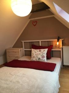 a bedroom with a bed with a heart on the wall at Familienhaus Stadtmitte in Neustrelitz