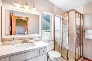 a bathroom with a sink and a shower and a toilet at Olympus View Home in Port Ludlow +40 photos