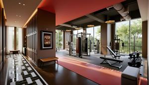 ein Fitnessraum mit einem Fitnessgerät und einem Laufband in der Unterkunft Marqen Hotel in Jakarta