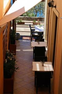 a restaurant with tables and chairs and a patio at Villa Ancora in Neum +34 photos
