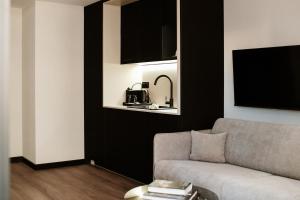 a living room with a couch and a table at Piano Property Rental Wrocław in Wrocław