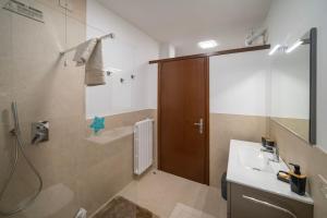 a bathroom with a shower and a sink and a shower at Interno 8 - Franciacorta x 7 in Passirano +28 photos