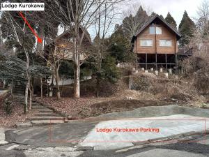 a house with a sign that reads logic khovkowa parking at Lodge Kurokawa 1 in Minamioguni +5 photos
