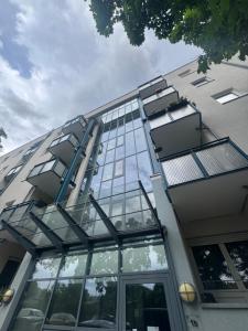 a building with glass balconies on the side of it at Stay Zentral Dresden in Dresden