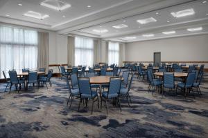 a large room with tables and chairs in it at Courtyard by Marriott Richmond Downtown in Richmond