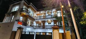 a large white building with a gate in front of it at Tushita Ladakh in Leh