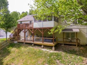 a large house with a deck and a porch at Our Happy Nest in Boone