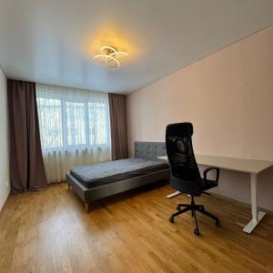Un pat sau paturi într-o cameră la Koidula Old Town Apartment +5 fotografii