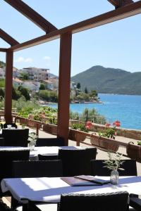 a restaurant with a view of the ocean at Villa Ancora in Neum