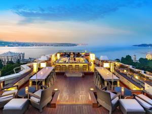 a deck of a cruise ship with tables and chairs at Swissotel The Bosphorus Istanbul in Istanbul