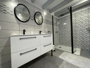 a white bathroom with a sink and a mirror at Ur ondoa in Lasse +18 photos
