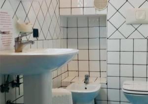 a bathroom with a sink and a toilet at View Ischia & Procida -Villa Lamberti Casa Panorama in Monte di Procida +23 photos