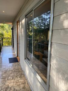 a sliding glass door on the side of a house at Cabaña Payer in Villarrica
