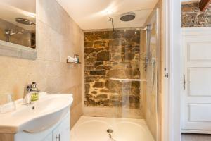 a bathroom with a sink and a shower at The Wagon in Michaelstow +14 photos