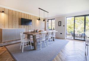 a kitchen and dining room with a table and chairs at Hilltop in Woodbridge