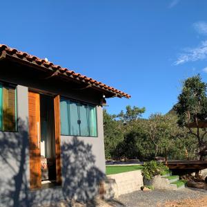 a house with a view of the yard at Casa mussambé in Sao Jorge