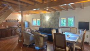 a living room with a couch and a table at Domki Magda Rewal in Rewal