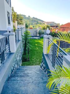 a stairway leading to a house with a yard at Bwebajja Hub in Bwebajja