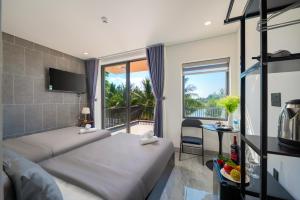 a hotel room with a bed and a balcony at Kikihao Homestay Hội An Near Tra Que Village in Hoi An +12 photos