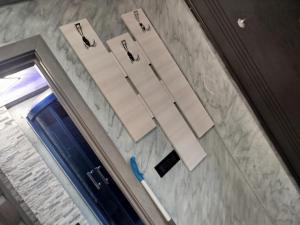 an open door with a pair ofippers and a blue scissors at Studio Denisa in Călan