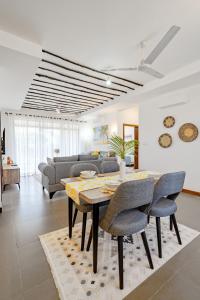 a living room with a table and a couch at Binti House- Sultan Palace in Mombasa