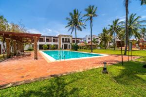 a swimming pool in the backyard of a house at Binti House- Sultan Palace in Mombasa