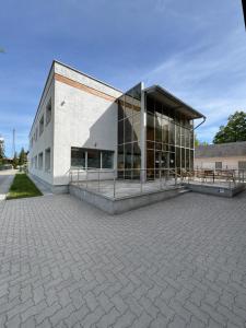 a large building with a lot of windows at Penzión Aurora Patince in Patince