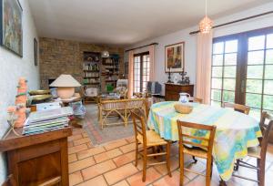 a living room with a table and chairs at Gite de Loche in Quet-en-Beaumont