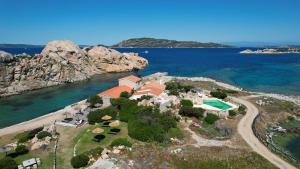 an aerial view of a house on an island in the water at Appartamento il Caracolo a Cala Francese in La Maddalena