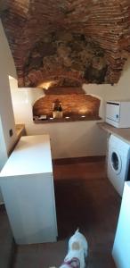 a dog laying on the floor in a room at Il Nido di Ory in Clusane sul Lago