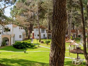 a view of the house from the garden at Del Pinar Apart in Costa del Este +19 photos