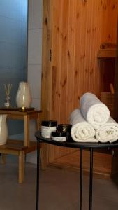 a table with towels on top of it at Penzión Aurora Patince in Patince +37 photos